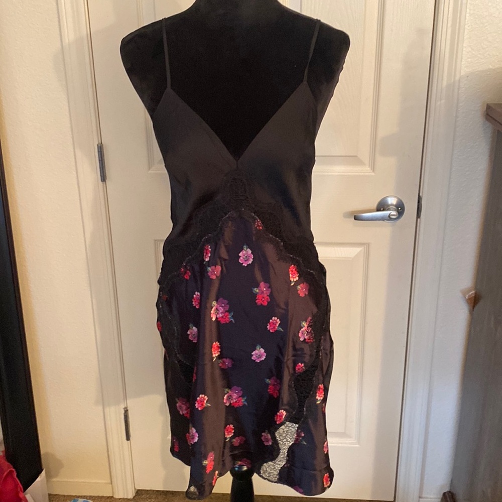 Victoria’s Secret slip. Black with pink and red flowers throughout. Size M NWT